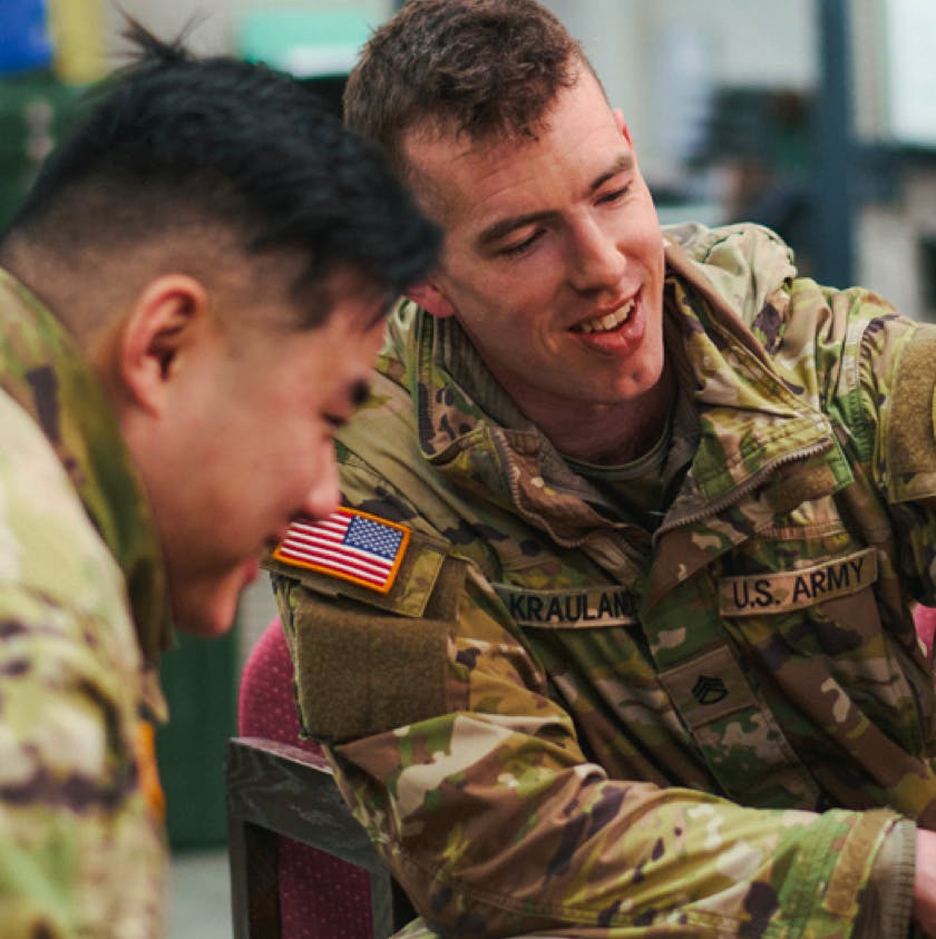 Two men in "U.S. Army" uniforms