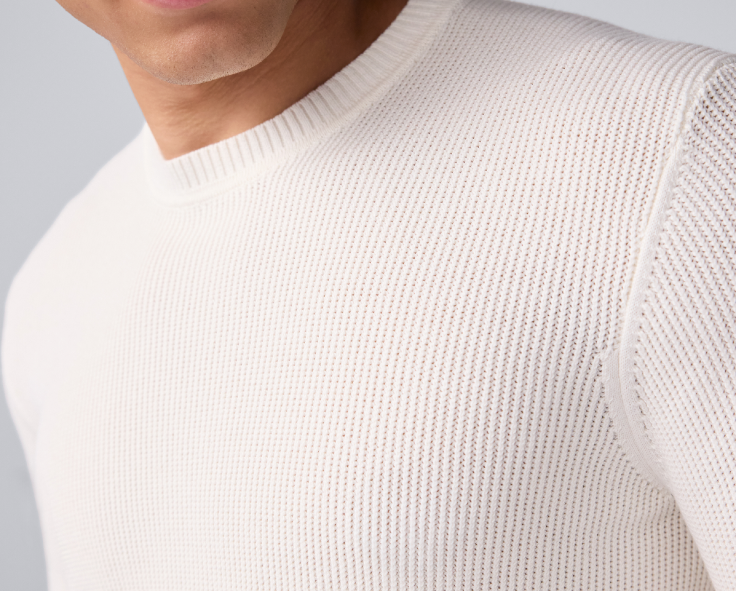 close up image of the texture of a white tech linen crew sweatshirt